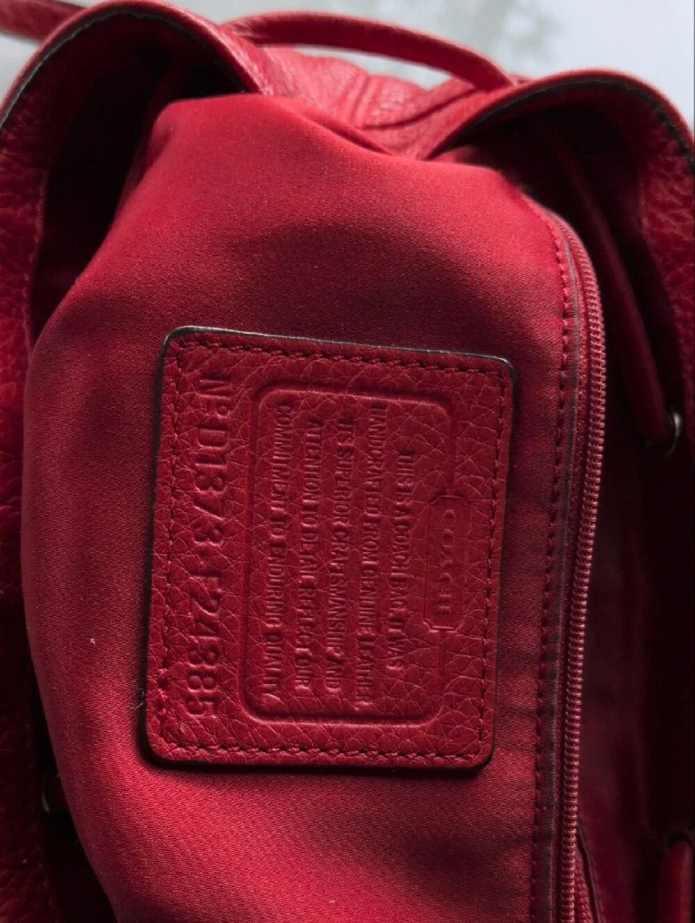 Coach sleek red